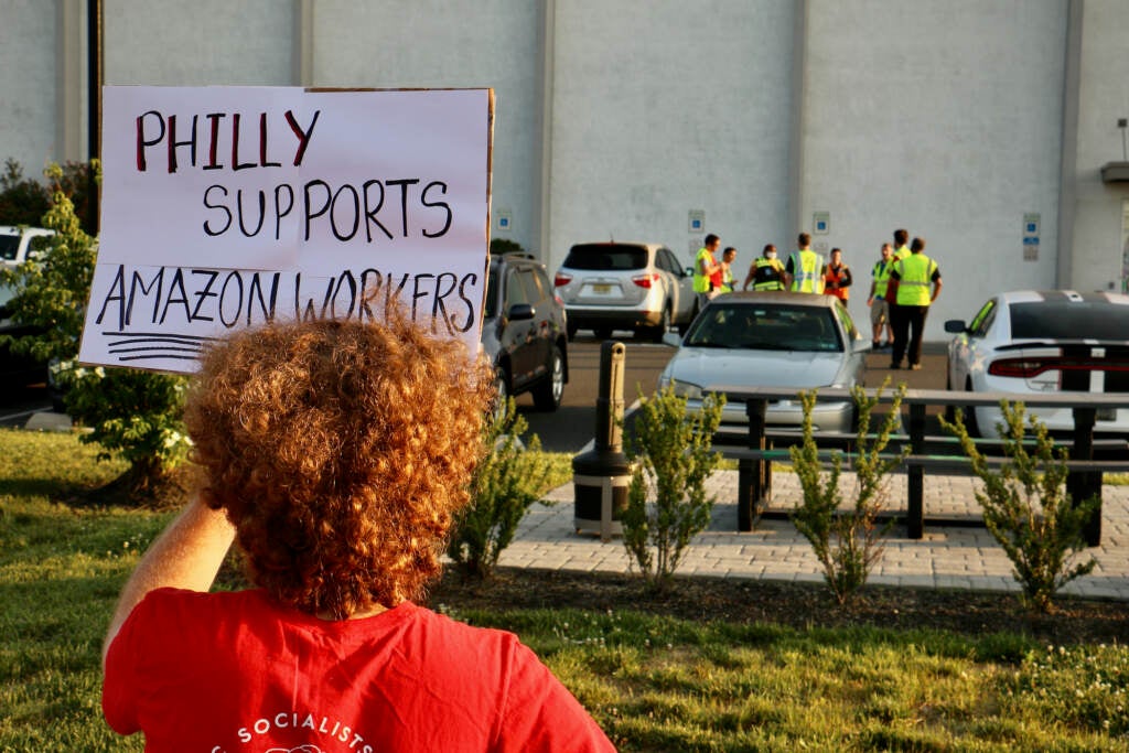 Supporters of Amazon workers gather outside a warehouse in Bellmawr