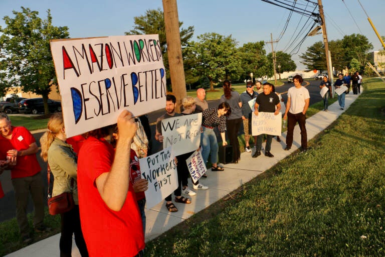 Supporters of Amazon workers gather outside a warehouse in Bellmawr