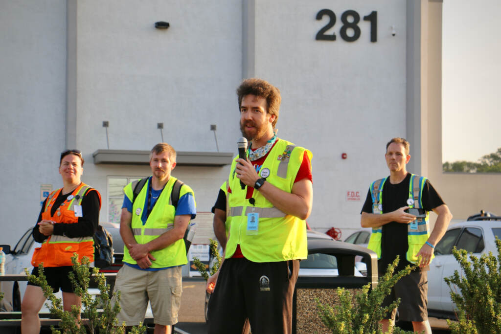 Amazon worker Paul Blundell speaks to supporters and members of the media during a walkout at Amazon's facility in Bellmawr