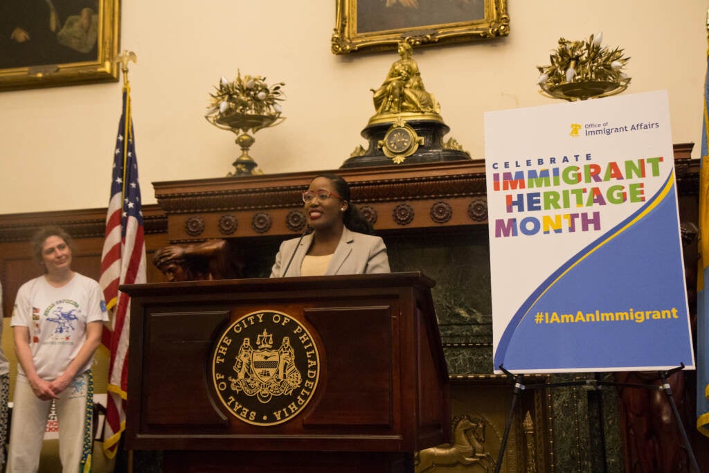 Jennifer Joseph speaks from a podium at City Hall