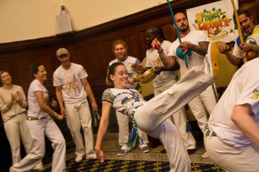 Members of the Brazilian performance group Project Capoeira are seen in motion