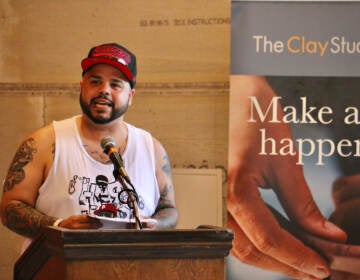 File photo: Artist Roberto Lugo, who created the mural, ''The Talented Mr. Trotter: You Can Be Anything'' reads a poem about the hardships of growing up in Kensington and the importance of arts education. (Emma Lee/WHYY)