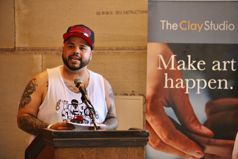 File photo: Artist Roberto Lugo, who created the mural, ''The Talented Mr. Trotter: You Can Be Anything'' reads a poem about the hardships of growing up in Kensington and the importance of arts education. (Emma Lee/WHYY)