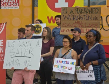 The Bicycle Coalition of Greater Philadelphia, Families for Safe Streets, Feet First Philly and the South of South Neighborhood Association gathered at 17th and Washington Avenue calling on Mayor Kenny and City Council to stick the with mixed lane configuration that was planned to make Washington Avenue safer for pedestrians and cyclists on June 2, 2022. (Kimberly Paynter/WHYY)