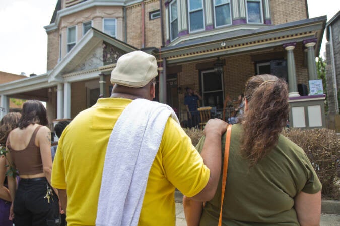 Harp player Christine Elise and rapper Kuf Knotz perform on Baltimore Avenue for West Philly Porchfest on June 4, 2022. (Kimberly Paynter/WHYY)