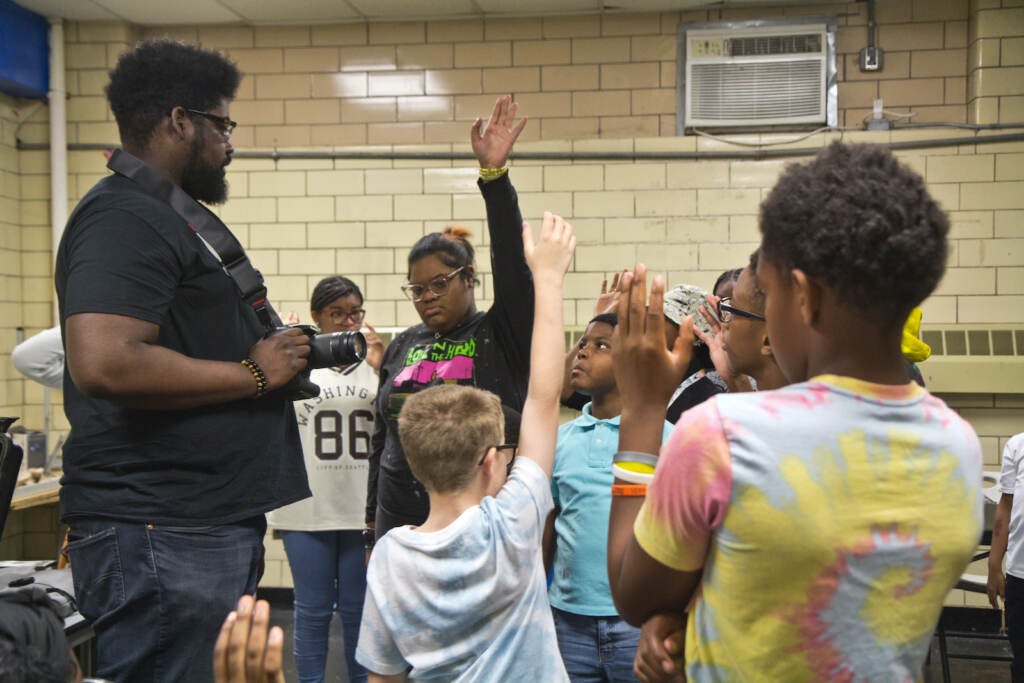 Kids in the Positive Choices program learn about video production from Jacques Princivil