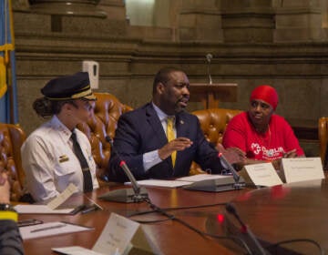 Philadelphia Police Commissioner Danielle Outlaw (left) briefly joined council member Kenyatta Johnson (center), other lawmakers and activists at a meeting to talk about solutions to gun violence in the city on June 9, 2022. (Kimberly Paynter/WHYY)