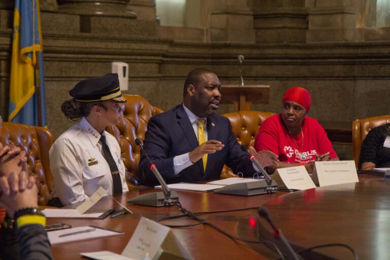 Philadelphia Police Commissioner Danielle Outlaw (left) briefly joined council member Kenyatta Johnson (center), other lawmakers and activists at a meeting to talk about solutions to gun violence in the city on June 9, 2022. (Kimberly Paynter/WHYY)