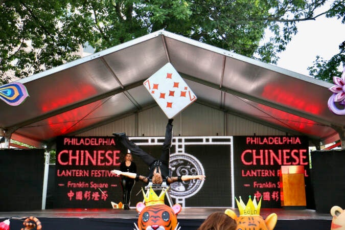 A foot juggler performs at the Chinese Lantern Festival at Franklin Square.