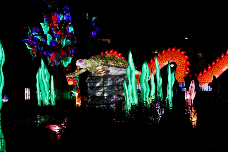 A sea turtle lantern sits in the midst of an underwater environment created from Chinese lanterns.