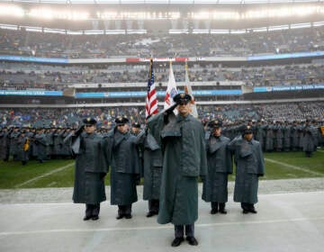 Army cadets salute before an NCAA college football game against Navy, Saturday, Dec. 14, 2019, in Philadelphia. (AP Photo/Matt Slocum)