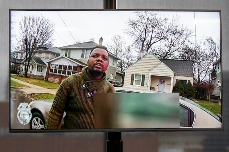 A TV display shows video evidence of a Grand Rapids police officer struggling with and shooting Patrick Lyoya at Grand Rapids City Hall on Wednesday, April 13, 2022. (Cory Morse | MLive.com)