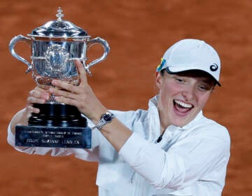 Poland's Iga Swiatek celebrates with the cup after defeating Coco Gauff of the U.S.in their final of the French Open tennis tournament at the Roland Garros stadium Saturday, June 4, 2022 in Paris. (AP Photo/Jean-Francois Badias)