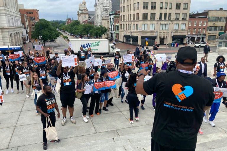 About 100 people marched to the Pennsylvania Capitol in Harrisburg, Pa., on Tuesday, June 7, 2022, to press for action to curb crime and assist its victims. The event was sponsored by Crime Survivors for Safety and Justice and urged lawmakers to take action. (AP Photo/Mark Scolforo)