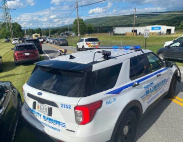 Law enforcement stages near the scene of a shooting at Columbia Machine, Inc., in Smithsburg, Md., Thursday, Jan. 9, 2022. (AP Photo/Tim Jacobsen)