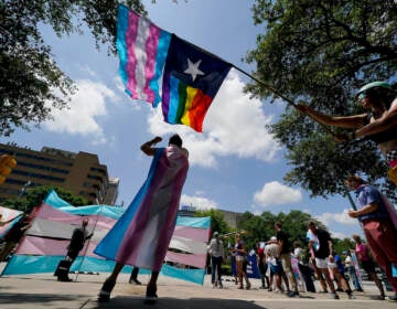 File photo: Demonstrators gather on the steps to the State Capitol to speak against transgender-related legislation bills being considered in the Texas Senate and Texas House, May 20, 2021, in Austin, Texas. A Texas judge on Friday, June 10, 2022, temporarily blocked the state from investigating families of transgender children who have received gender-confirming medical care, a new obstacle to the state labeling such treatments as child abuse. (AP Photo/Eric Gay, File)