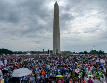 People participate in the second March for Our Lives rally in support of gun control in front of the Washington Monument, Saturday, June 11, 2022, in Washington. (AP Photo/Gemunu Amarasinghe)