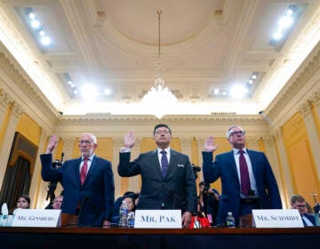 Benjamin Ginsberg, Washington attorney and elections lawyer, left, BJay Pak, former U.S. Attorney in Atlanta, center, and Al Schmidt, former city commissioner of Philadelphia, are sworn in to testify as the House select committee investigating the Jan. 6 attack on the U.S. Capitol continues to reveal its findings of a year-long investigation, at the Capitol in Washington, Monday, June 13, 2022. (AP Photo/Susan Walsh)