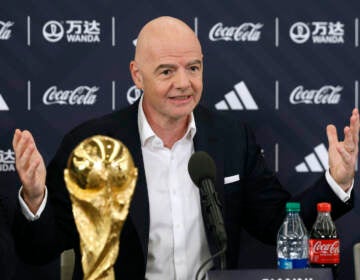 FIFA President Gianni Infantino answers questions during a 2026 soccer World Cup news conference Thursday, June 16, 2022, in New York. (AP Photo/Noah K. Murray)