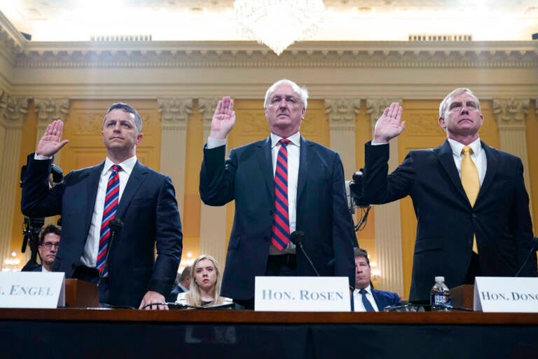 Steven Engel, former Assistant Attorney General for the Office of Legal Counsel, from left, Jeffrey Rosen, former acting Attorney General, and Richard Donoghue, former acting Deputy Attorney General, are sworn in to testify as the House select committee investigating the Jan. 6 attack on the U.S. Capitol continues to reveal its findings of a year-long investigation, at the Capitol in Washington, Thursday, June 23, 2022. (AP Photo/Jacquelyn Martin)