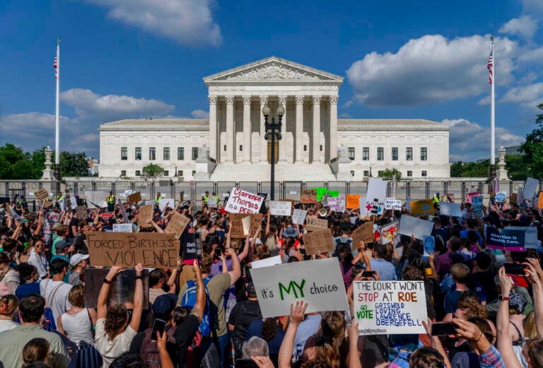 Abortion-rights and anti-abortion demonstrators gather outside of the Supreme Court in Washington, Friday, June 24, 2022. The Supreme Court has ended constitutional protections for abortion that had been in place nearly 50 years, a decision by its conservative majority to overturn the court's landmark abortion cases. (AP Photo/Gemunu Amarasinghe)