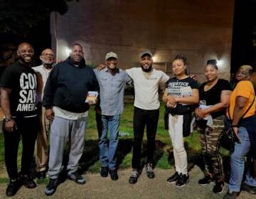 G. Lamar Stewart (middle) with anti violence activists and faith leaders on evening walk, which is part of June effort to interrupt cycle of gun violence. (Courtesy of TaylorMADE Opportunities)