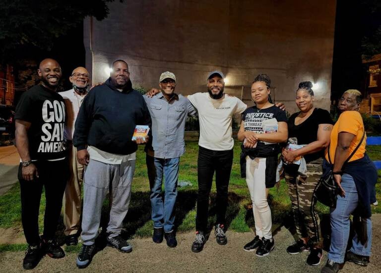 G. Lamar Stewart (middle) with anti violence activists and faith leaders on evening walk, which is part of June effort to interrupt cycle of gun violence. (Courtesy of TaylorMADE Opportunities)