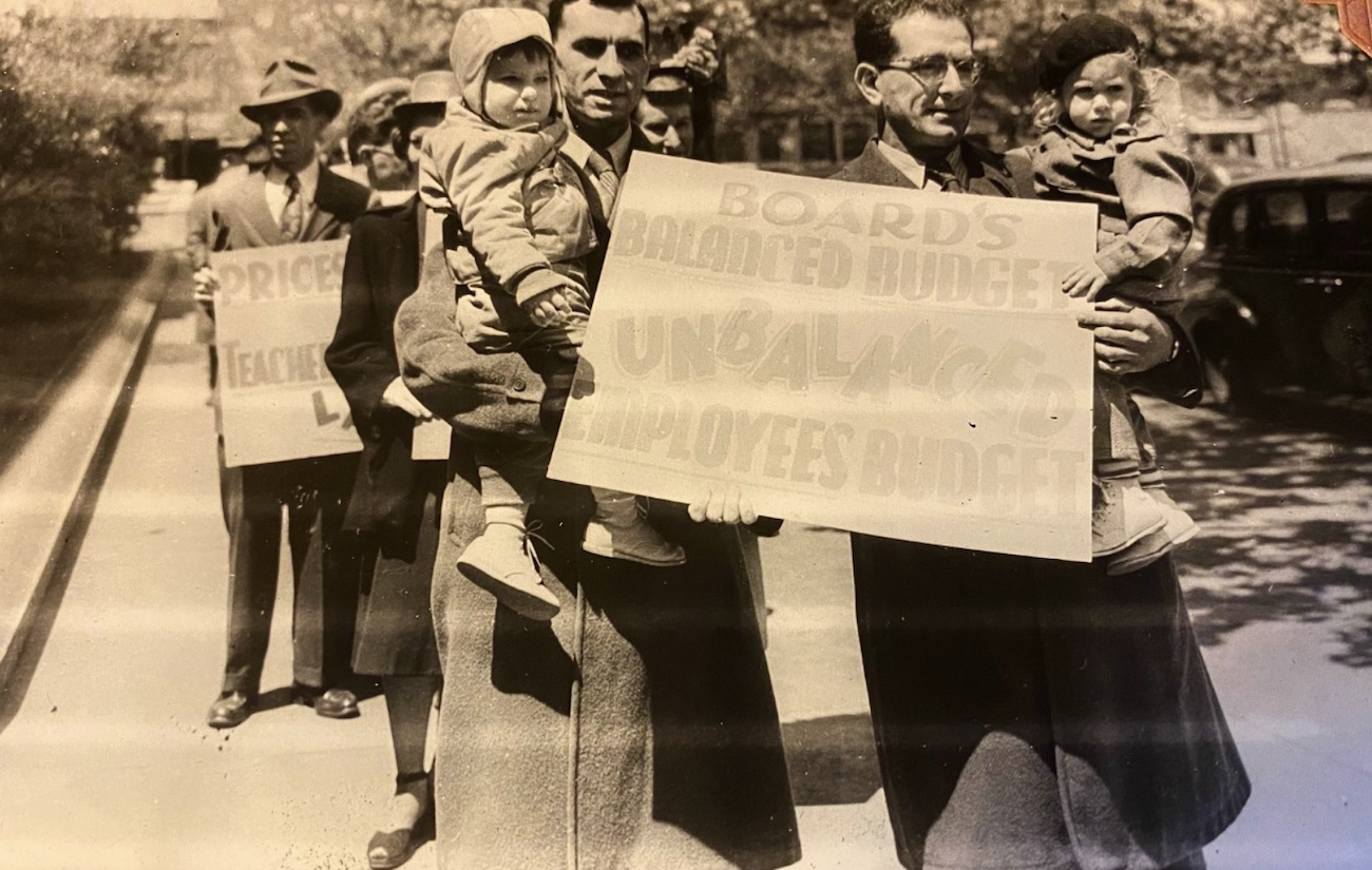 Philadelphia teacher Herman Beilan (right) holding his daughter, Judy, at a protest. (Courtesy of Judy Gandy)