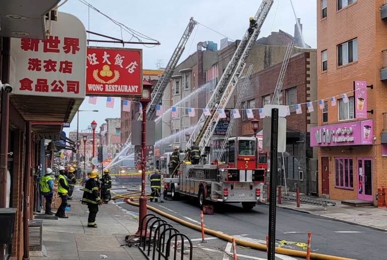 The fire has caused an almost complete shutdown of the Chinatown business area. (Tom MacDonald / WHYY)