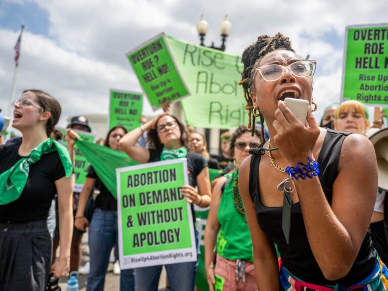 Abortion rights demonstrator Elizabeth White leads a chant in response to the Dobbs v. Jackson Women's Health Organization ruling in front of the U.S. Supreme Court on June 24, 2022 in Washington, DC.