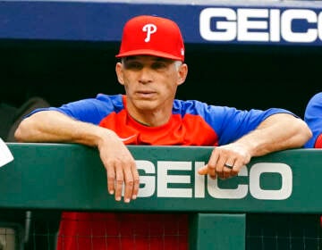 Philadelphia Phillies manager Joe Girardi watches from the dugout during the first inning of the team's baseball game against the Atlanta Braves on Wednesday, May 25, 2022, in Atlanta.