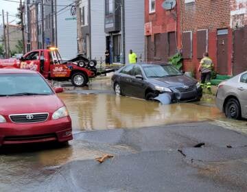 The scene of a water main break near Fourth and Hewson streets in Kensington.