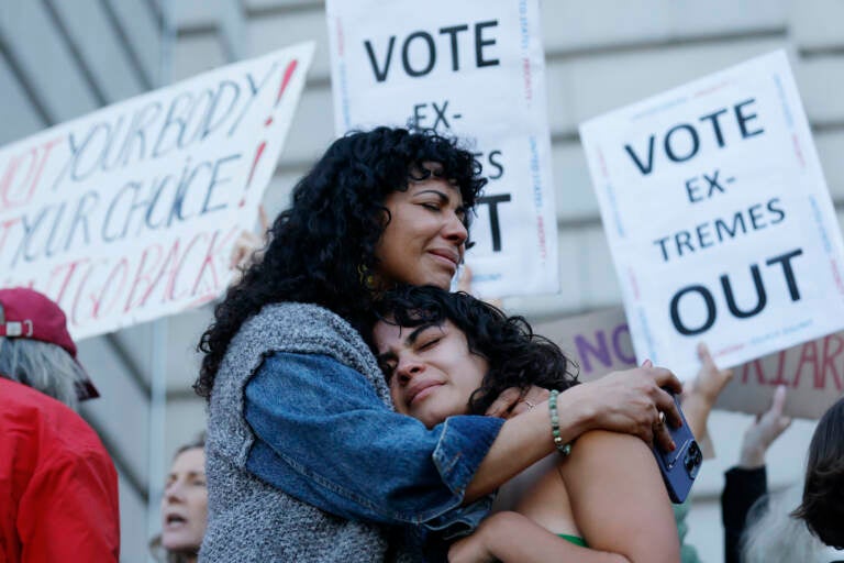 Mitzi Rivas, left, hugs her daughter Maya Iribarren during an abortion-rights protest at City Hall in San Francisco