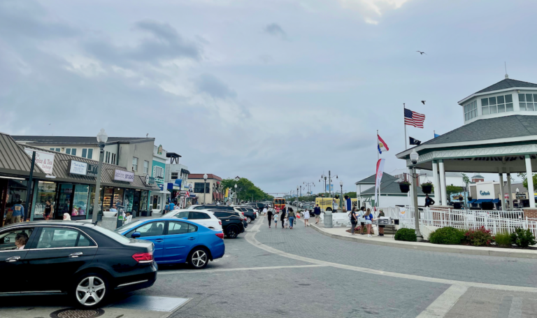 Shops, cars, and attractions are seen at Rehoboth Beach during the summer
