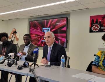 Senator Bob Casey and Councilmember Isaiah Thomas speak with students at Temple university about gun control. (Tom MacDonald / WHYY)