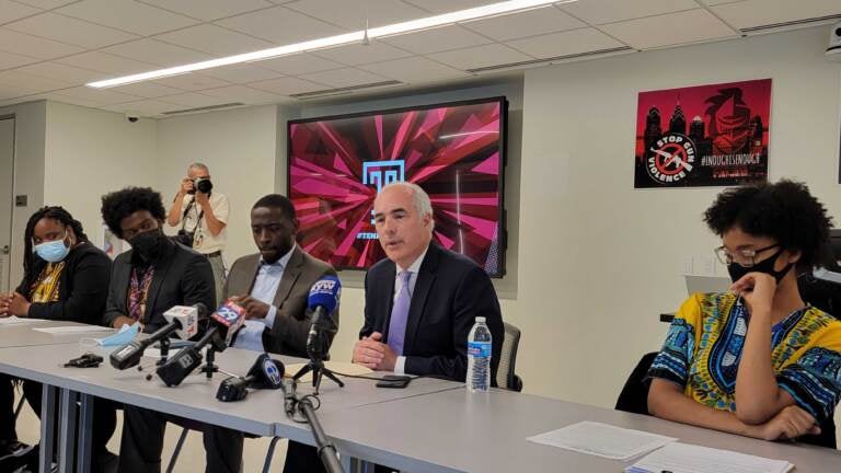 Senator Bob Casey and Councilmember Isaiah Thomas speak with students at Temple university about gun control. (Tom MacDonald / WHYY)