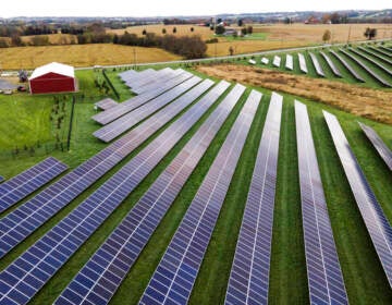 Aerial view of solar panels on a farm.