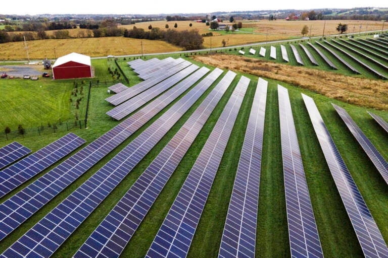 Aerial view of solar panels on a farm.