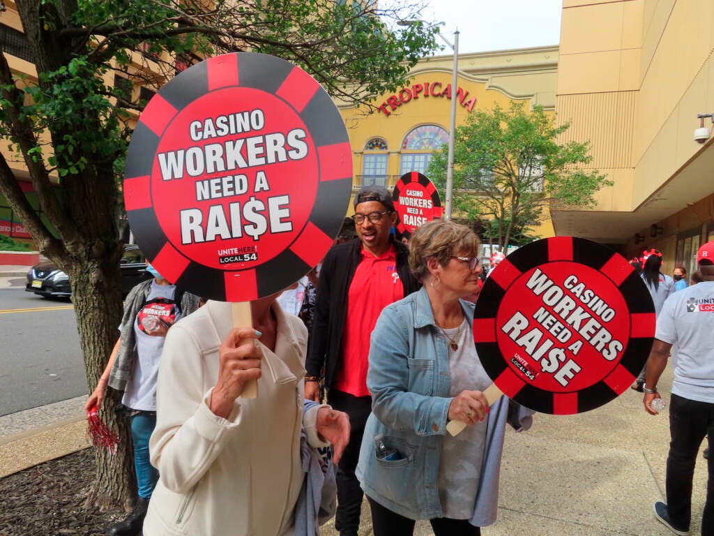 Members of Local 54 of the Unite Here casino workers union picket outside the Tropicana casino
