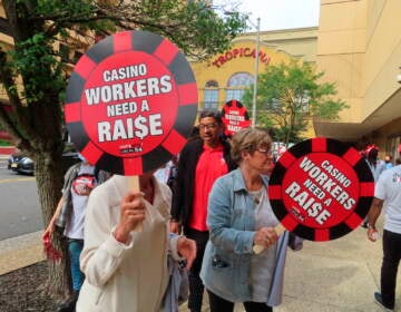 Members of Local 54 of the Unite Here casino workers union picket outside the Tropicana casino