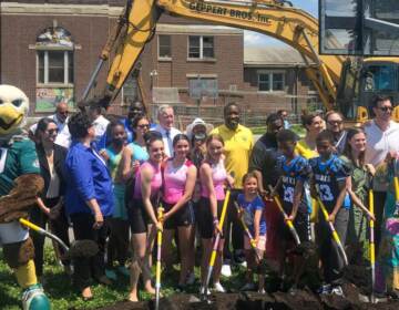 Swoop, Mayor Kenney, Councilmember Johnson, other officials, and community members help with the groundbreaking at Vare Recreation Center
Swoop, Mayor Kenney, Councilmember Johnson, other officials, and community members help with the groundbreaking at Vare Recreation Center. (Jordan Levy/Billy Penn)