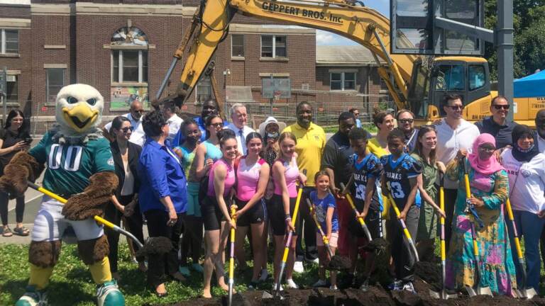 Swoop, Mayor Kenney, Councilmember Johnson, other officials, and community members help with the groundbreaking at Vare Recreation Center
Swoop, Mayor Kenney, Councilmember Johnson, other officials, and community members help with the groundbreaking at Vare Recreation Center. (Jordan Levy/Billy Penn)
