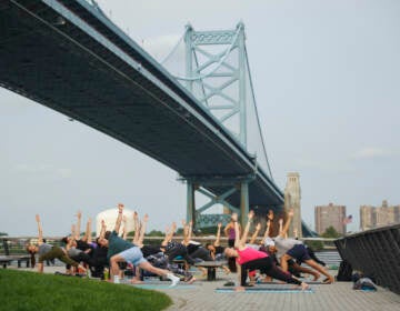 Wellness on the Waterfront, a summer series of free outdoor exercise classes on the Race Street Pier, is back for a full season of yoga and pilates. (Photo courtesy of Delaware River Waterfront Corporation)