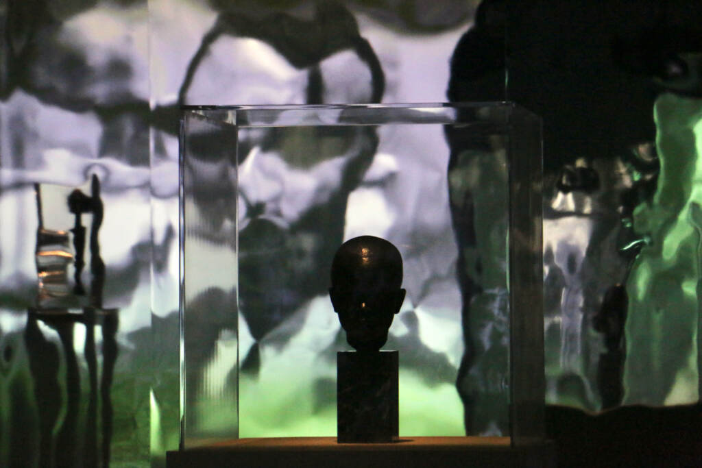 A close-up view of African art under glass.