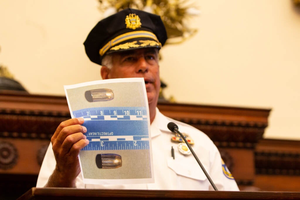 Chief Inspector Frank Vanore shows photos of bullets recovered from the Fourth of July shooting