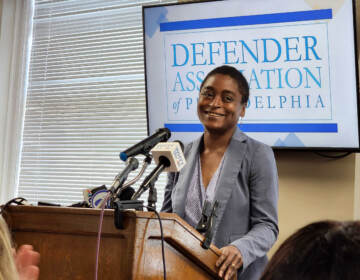 Chief Defender Keisha Hudson gets applause from staff at announcement of wage increases. (Tom MacDonald / WHYY)