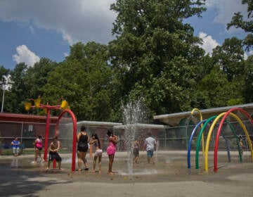 Families enjoy the sprinklers at Ferko Playground
