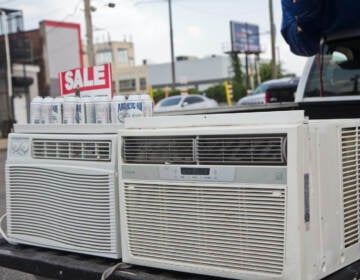 AC units for sale on the back of a pick-up truck