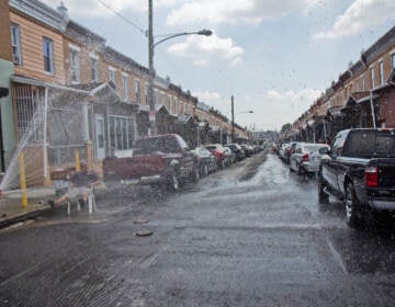 An open fire hydrant is pictured on Reese Street in Philly's Hunting Park neighborhood