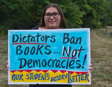 Michaela holds up a sign that says ''Dictators ban books ... not democracies!''